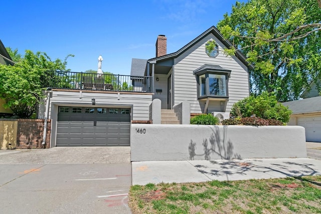 1460 36th St, Minneapolis, MN 55408 - view of front facade featuring a chimney and driveway