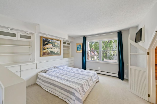 1460 36th St, Minneapolis, MN 55408 - bedroom featuring a baseboard heating unit, light colored carpet, and a textured ceiling