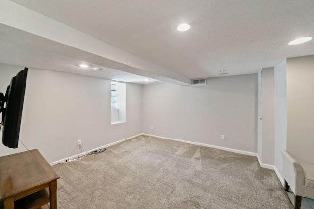 1460 36th St, Minneapolis, MN 55408 - basement with carpet floors, baseboards, a textured ceiling, and recessed lighting