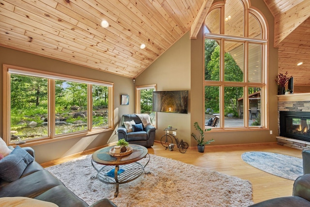 40335 Government Rd, Barry Twp, MN 55037 - living room with high vaulted ceiling, a fireplace, wood finished floors, wooden ceiling, and recessed lighting