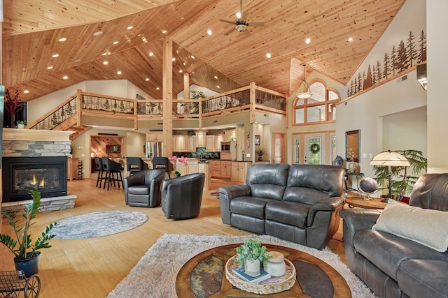 40335 Government Rd, Barry Twp, MN 55037 - living room with high vaulted ceiling, light wood-style floors, ceiling fan, recessed lighting, and wood ceiling