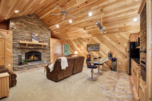 40335 Government Rd, Barry Twp, MN 55037 - carpeted living area with wood ceiling, lofted ceiling, a ceiling fan, recessed lighting, and a stone fireplace