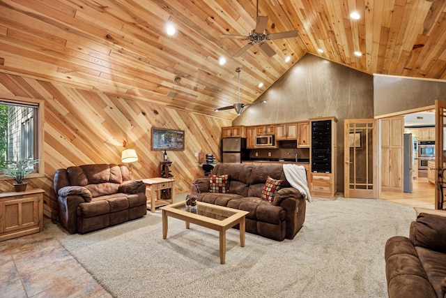 40335 Government Rd, Barry Twp, MN 55037 - living area with high vaulted ceiling, wooden ceiling, ceiling fan, recessed lighting, and wood walls
