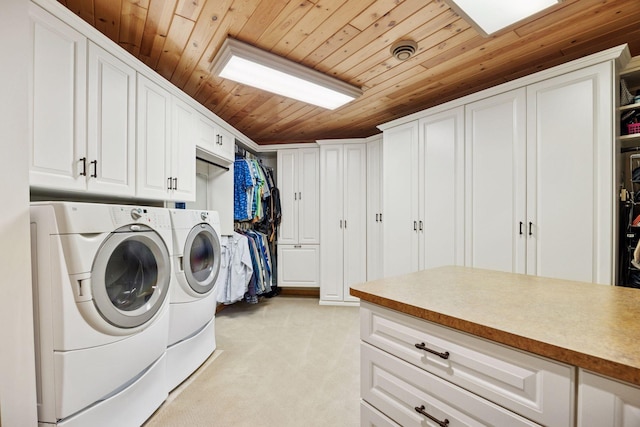 40335 Government Rd, Barry Twp, MN 55037 - washroom with cabinet space, washing machine and dryer, wood ceiling, and light colored carpet