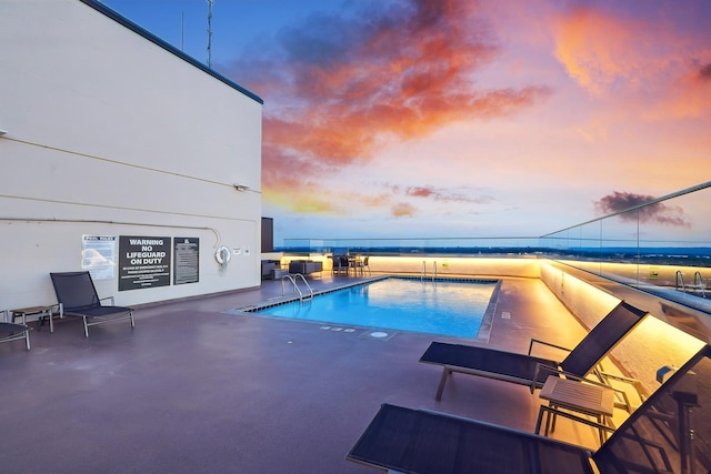 400 Groveland Ave Unit 1512, Minneapolis, MN 55403 - pool at dusk with a patio and a community pool