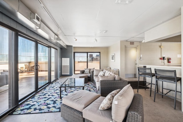 400 Groveland Ave Unit 1512, Minneapolis, MN 55403 - living room featuring concrete floors and concrete block wall