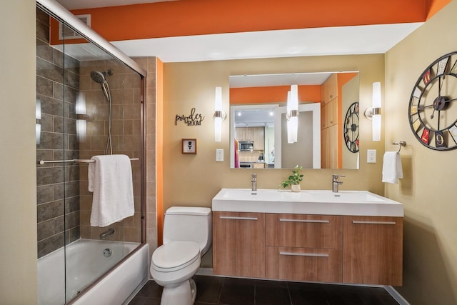 400 Groveland Ave Unit 1512, Minneapolis, MN 55403 - bathroom with toilet, bath / shower combo with glass door, double vanity, and tile patterned floors