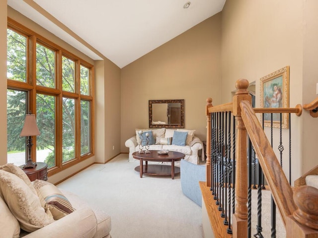 5705 Quinwood Ln N, Plymouth, MN 55442 - carpeted living room with high vaulted ceiling and baseboards