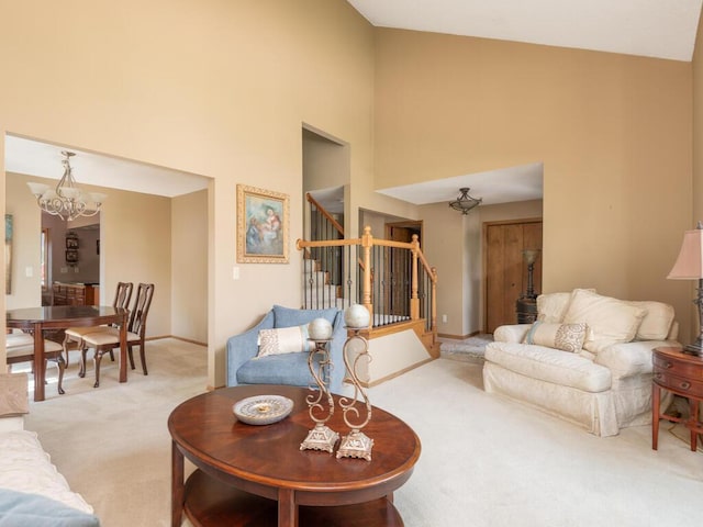 5705 Quinwood Ln N, Plymouth, MN 55442 - living area featuring carpet flooring, stairs, a chandelier, a towering ceiling, and baseboards