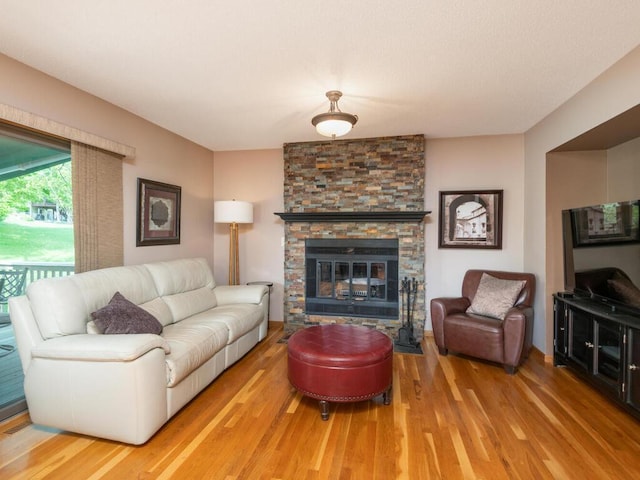 5705 Quinwood Ln N, Plymouth, MN 55442 - living area with wood finished floors and a stone fireplace