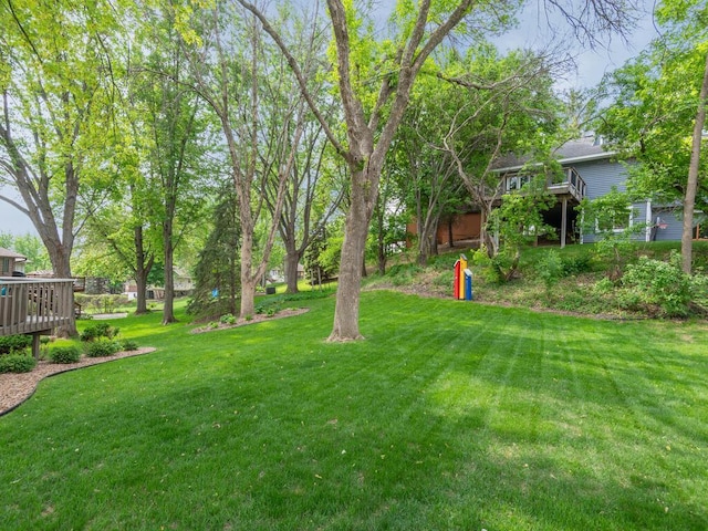 5705 Quinwood Ln N, Plymouth, MN 55442 - view of green lawn with a wooden deck