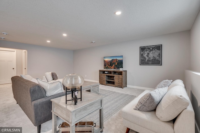 living room featuring light colored carpet, recessed lighting, a textured ceiling, and baseboards