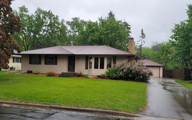 8464 Meadow Lake Rd N, New Hope, MN 55428 - ranch-style house with a chimney and a garage