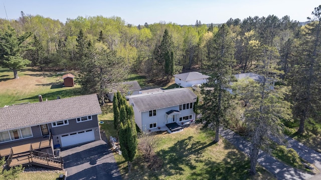 view of subject property featuring a forest