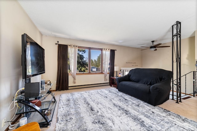 carpeted living area with baseboard heating and a ceiling fan