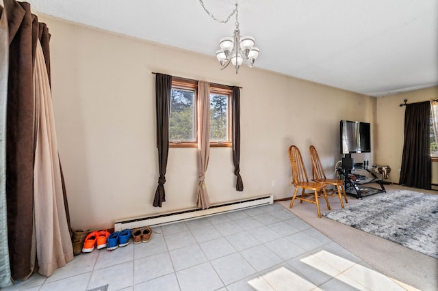 dining room with baseboard heating and a chandelier