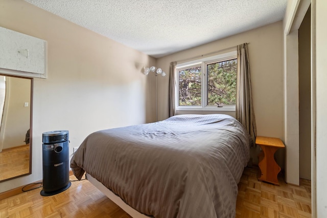 bedroom featuring a textured ceiling
