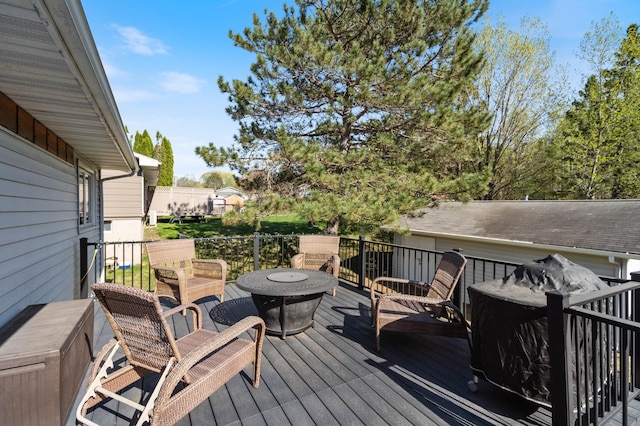 wooden terrace featuring an outdoor hangout area