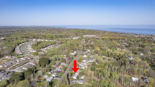 aerial view of property's location with a heavily wooded area