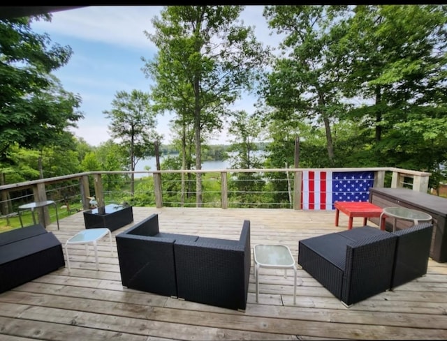 30091 Sunny Beach Rd, Harris Twp, MN 55744 - wooden terrace featuring outdoor lounge area, a water view, and view of scattered trees
