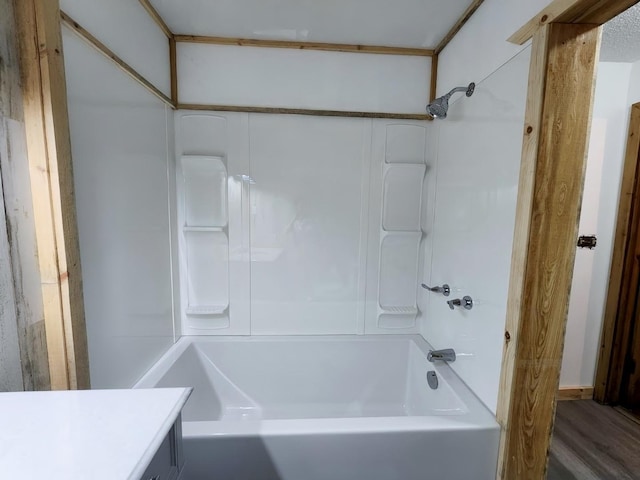 30091 Sunny Beach Rd, Harris Twp, MN 55744 - bathroom with shower / bath combination, vanity, and wood finished floors