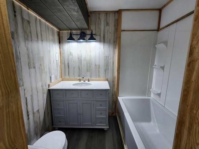 30091 Sunny Beach Rd, Harris Twp, MN 55744 - full bath with wood finished floors, toilet, and vanity
