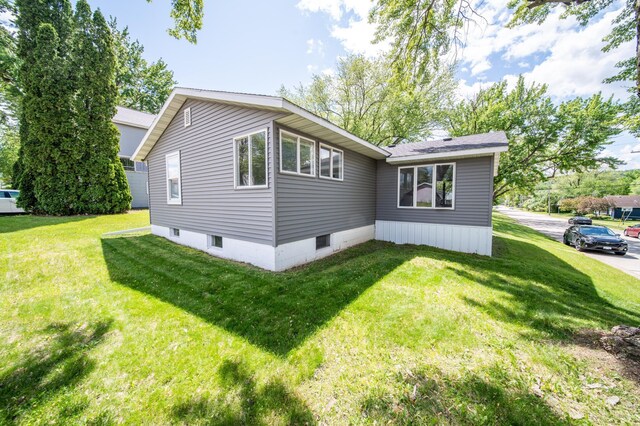 306 Hiawatha Dr E, Wabasha, MN 55981 - view of home's exterior featuring a lawn