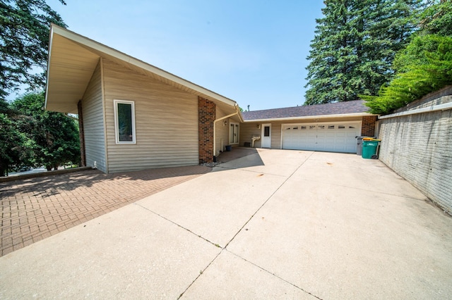 1723 Teton Ln NE, Rochester, MN 55906 - view of front of property with an attached garage, driveway, and brick siding