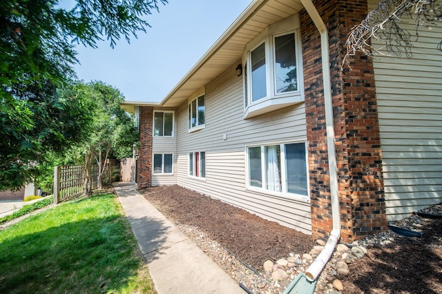 1723 Teton Ln NE, Rochester, MN 55906 - view of side of home featuring brick siding