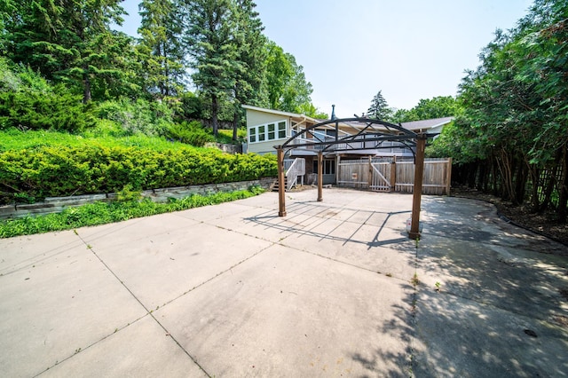1723 Teton Ln NE, Rochester, MN 55906 - view of patio with concrete driveway and a carport