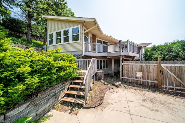 1723 Teton Ln NE, Rochester, MN 55906 - back of house with stairs and a wooden deck