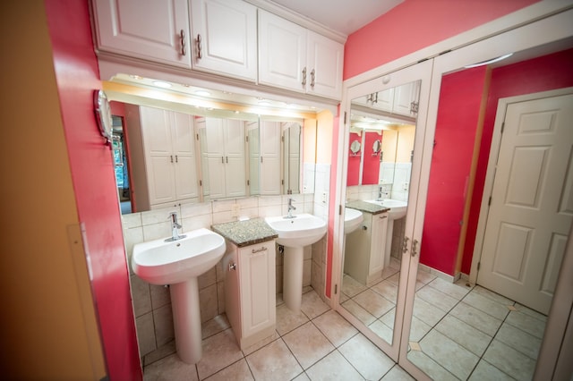 1723 Teton Ln NE, Rochester, MN 55906 - bathroom featuring two sinks, tile patterned floors, and tasteful backsplash