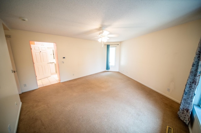 1723 Teton Ln NE, Rochester, MN 55906 - spare room with light colored carpet, ceiling fan, baseboards, and a smoke detector