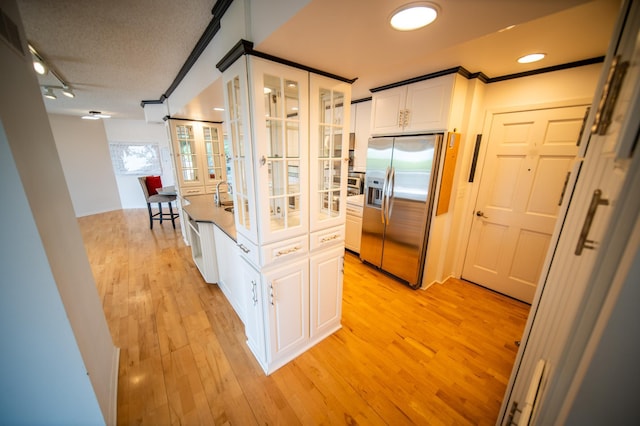1723 Teton Ln NE, Rochester, MN 55906 - hall featuring french doors, light wood-type flooring, rail lighting, and crown molding