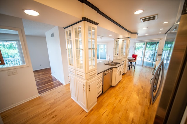1723 Teton Ln NE, Rochester, MN 55906 - kitchen with stainless steel dishwasher, a sink, light wood-type flooring, french doors, and recessed lighting