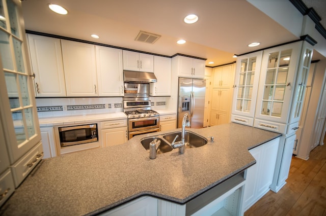 1723 Teton Ln NE, Rochester, MN 55906 - kitchen featuring stainless steel appliances, under cabinet range hood, a sink, white cabinetry, and recessed lighting