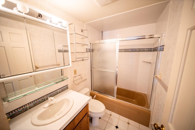 1723 Teton Ln NE, Rochester, MN 55906 - bathroom with vanity, combined bath / shower with glass door, toilet, and tile patterned flooring