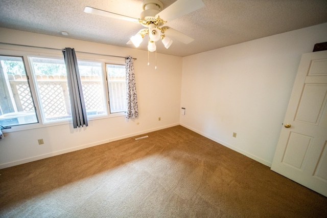 1723 Teton Ln NE, Rochester, MN 55906 - empty room featuring carpet, a ceiling fan, a textured ceiling, and baseboards
