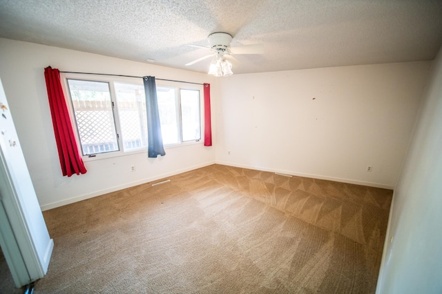 1723 Teton Ln NE, Rochester, MN 55906 - carpeted empty room featuring a textured ceiling, ceiling fan, and baseboards