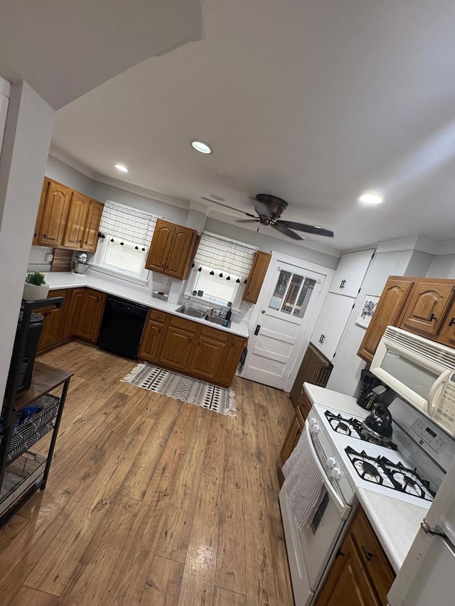 112 Main St, Sherburn, MN 56171 - kitchen with white appliances, light countertops, dark wood finished floors, recessed lighting, and a ceiling fan