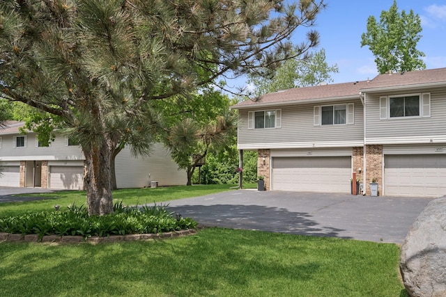 1301 Crestridge Ln, Eagan, MN 55123 - multi unit property with a front yard, brick siding, driveway, and an attached garage