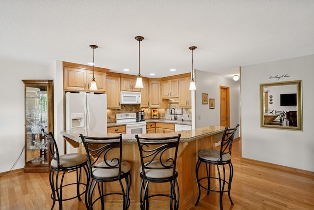 1301 Crestridge Ln, Eagan, MN 55123 - kitchen featuring white appliances, a sink, baseboards, light wood finished floors, and recessed lighting