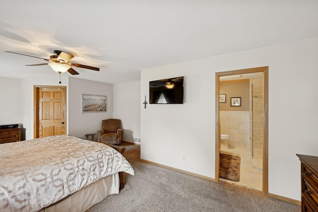 1301 Crestridge Ln, Eagan, MN 55123 - carpeted bedroom with baseboards, connected bathroom, and a ceiling fan