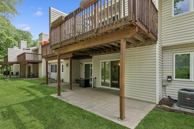 1301 Crestridge Ln, Eagan, MN 55123 - back of house with a lawn, a patio, cooling unit, and a wooden deck