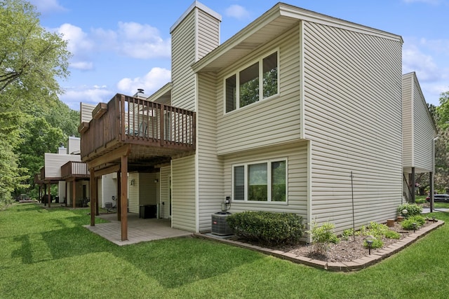 1301 Crestridge Ln, Eagan, MN 55123 - rear view of house with a lawn, a deck, a chimney, and a patio