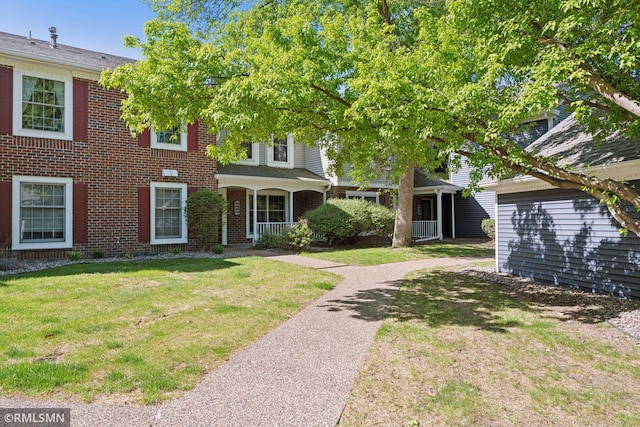 7475 110th St W, Bloomington, MN 55438 - view of front of house featuring a front yard and brick siding