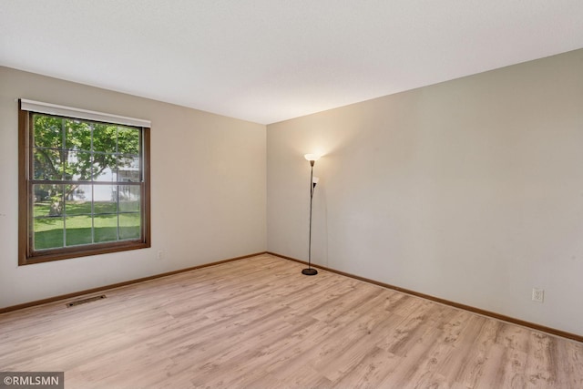 7475 110th St W, Bloomington, MN 55438 - unfurnished room with light wood-style floors and baseboards