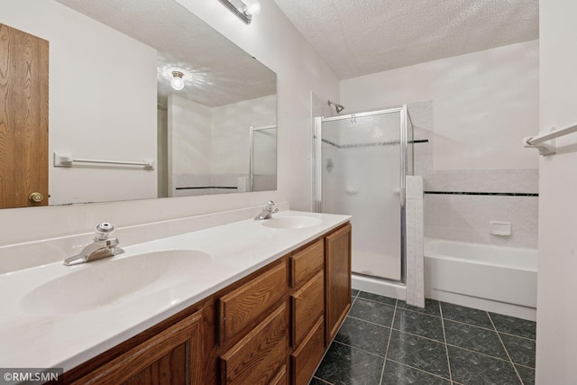 7475 110th St W, Bloomington, MN 55438 - bathroom with a shower stall, double vanity, tile patterned floors, a textured ceiling, and a bath