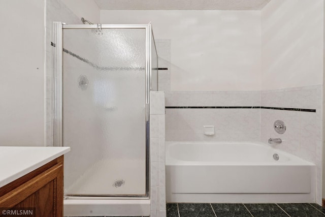 7475 110th St W, Bloomington, MN 55438 - bathroom featuring vanity, a stall shower, tile patterned flooring, and a bath