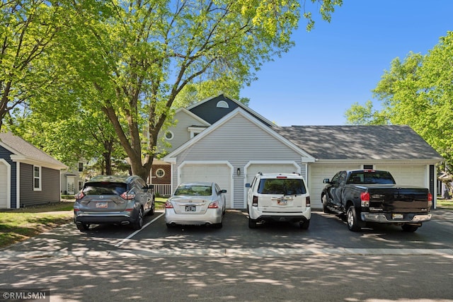 7475 110th St W, Bloomington, MN 55438 - traditional-style home with a garage, concrete driveway, and a shingled roof